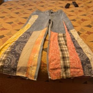 Flared bottom jeans.